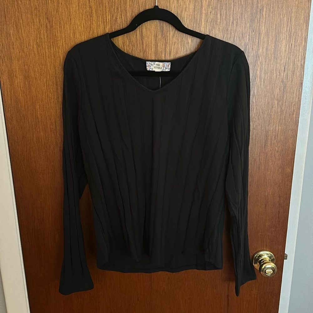 Black vneck long sleeved shirt. Never worn